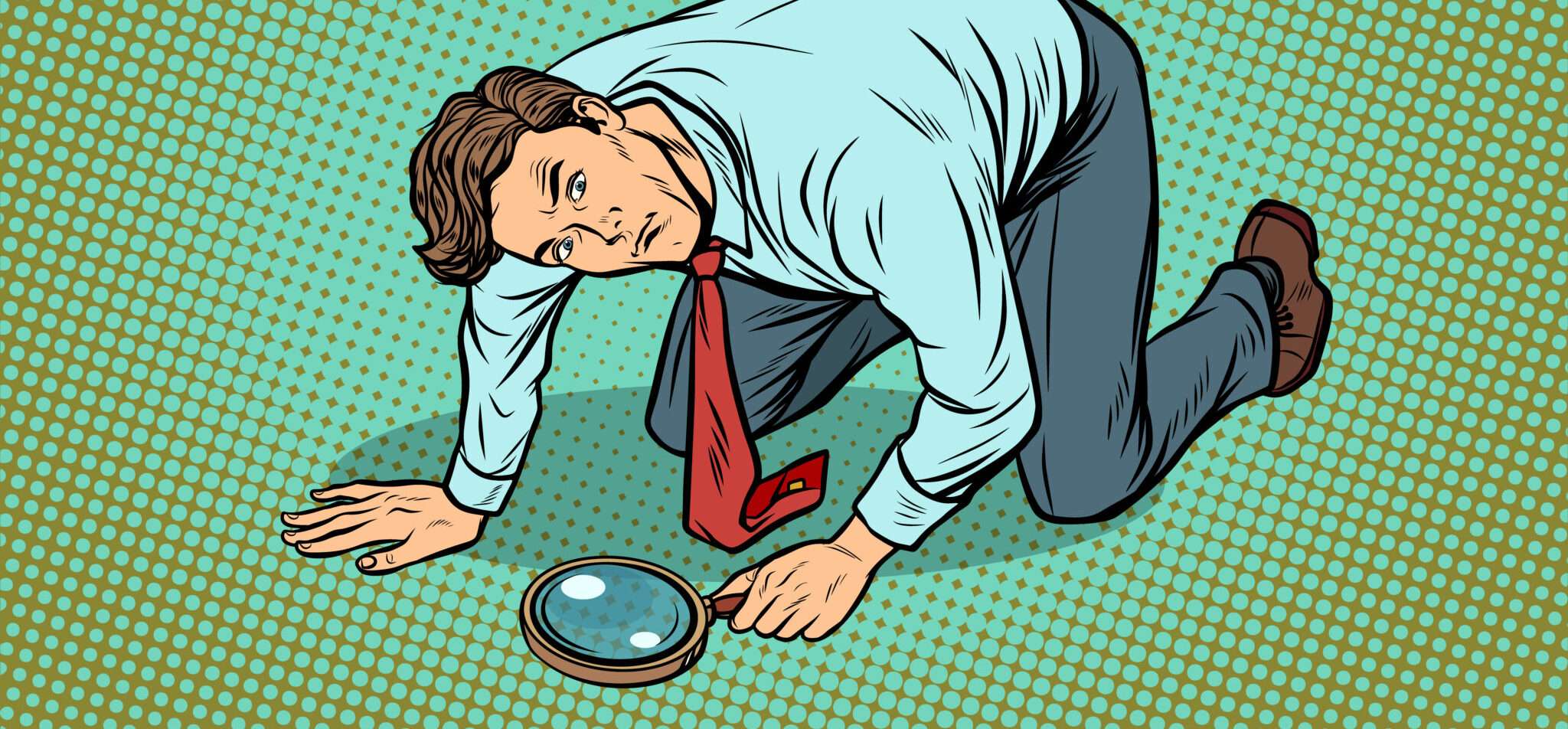 フランスで男性が虫眼鏡を覗いている。