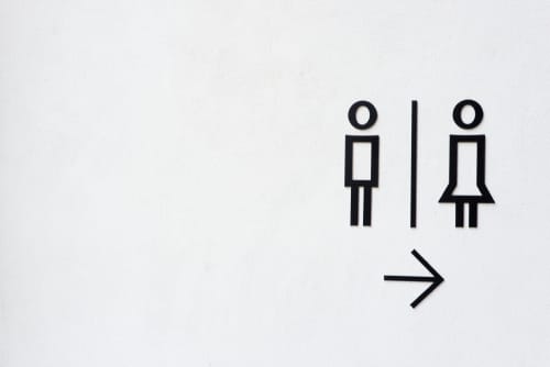 バスルームにいる男女を描いたフランスの看板。 バスルームにいる男女を描いたフランスの看板。